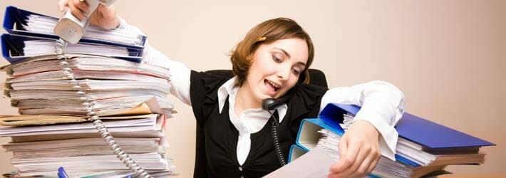 Busy Office Receptionist At Desk