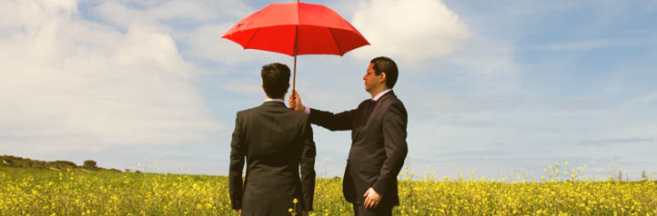 Insurance agent protecting a business person