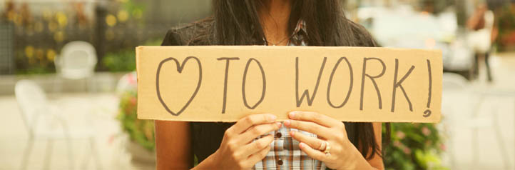 Woman holding up sign looking for work