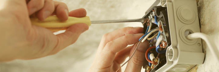 Electrician wiring a junction box