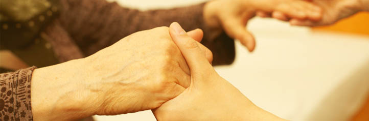 Holding hands with a hospice worker