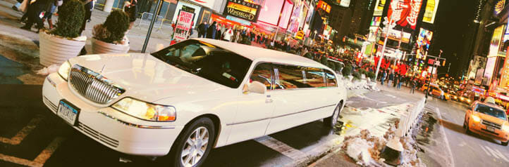 White limousine driving through New York City