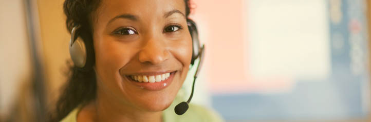 Smiling operator working to keep customers happy