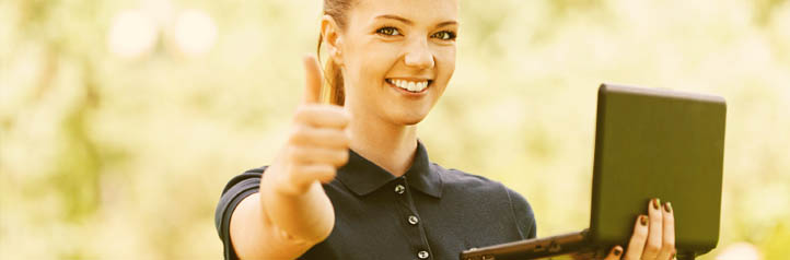 IT support employee holding a laptop