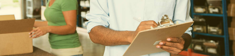 Warehouse employees taking orders and shipping packages