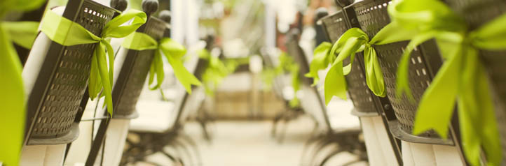 Event chairs with green ribbon