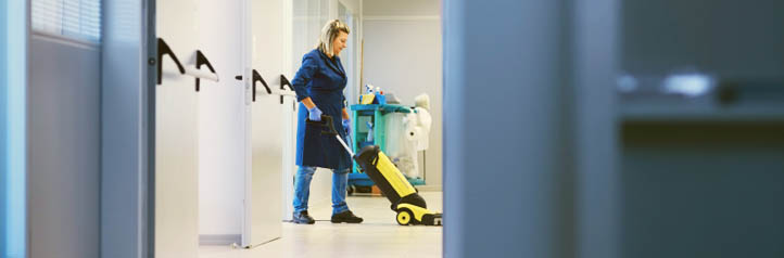 Janitor cleaning an business office