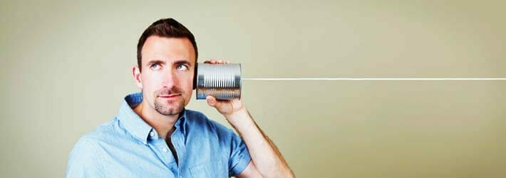 Man Talking on Tin Can Phone