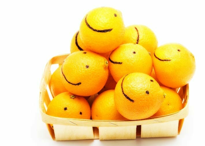 Basket of smiling oranges