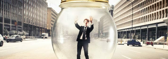 Business person trapped in a jar